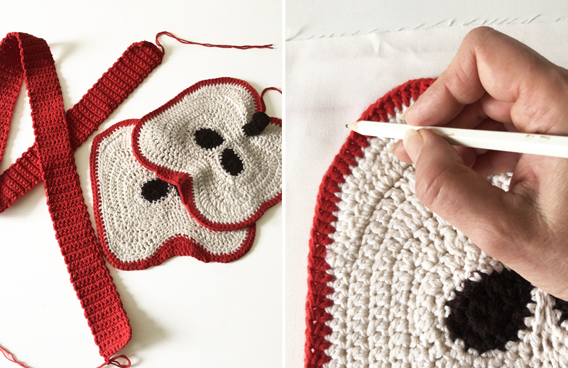 Two-step process of making a crochet apple slice bag: First, crochet bag parts laid out on a table. Second, hands tracing the outline of one apple slice piece onto fabric for the lining.