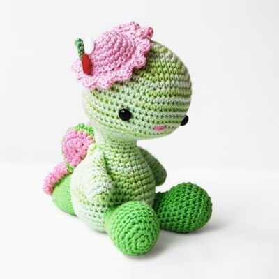 Crochet dragon with pink hat