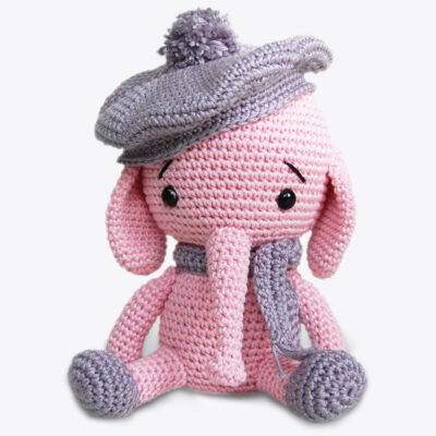 Crochet elephant with the hat, sitting on the floor