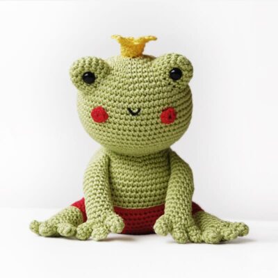 Crochet frog prince with crown on his head