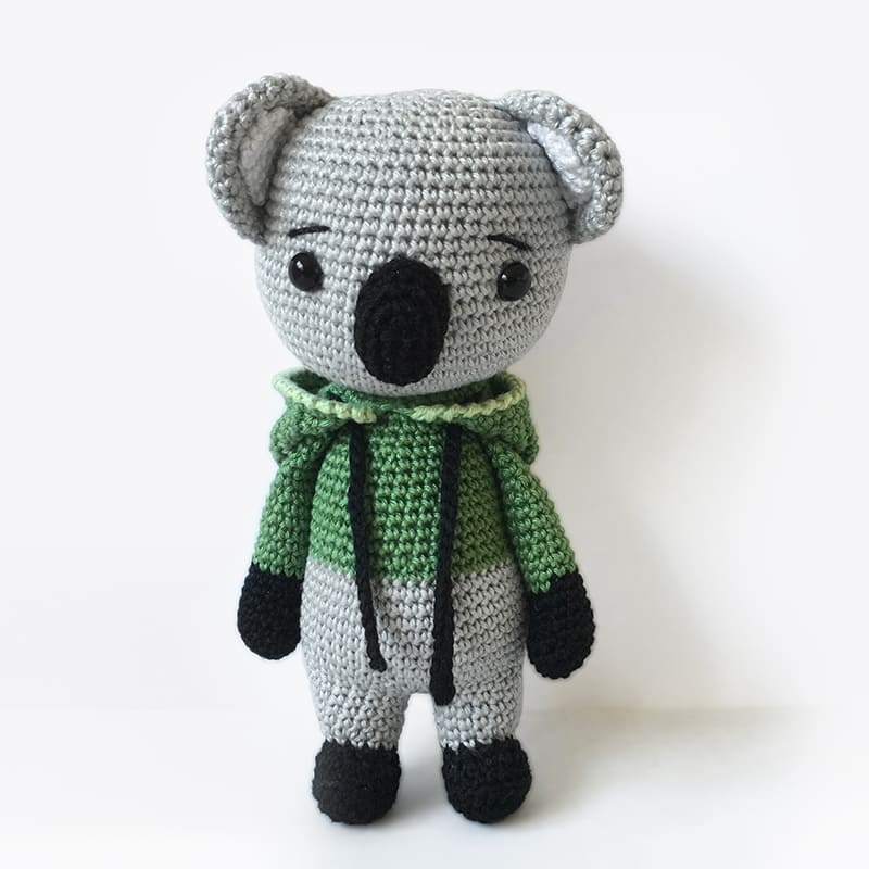 Crochet amigurumi Kelly the Koala wearing green hoodie