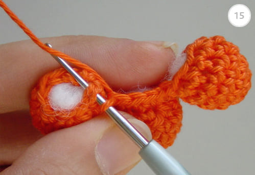 Close up of crocheting together the 3 owl's toes