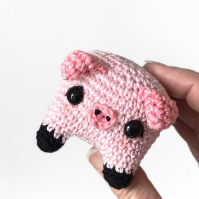 Cute crochet pig keychain hold in hand