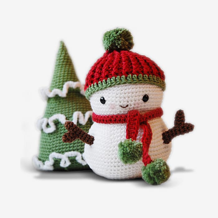 Amigurumi crochet snowman wearing hat with pom pom and a scarf, and Christmas tree pattern