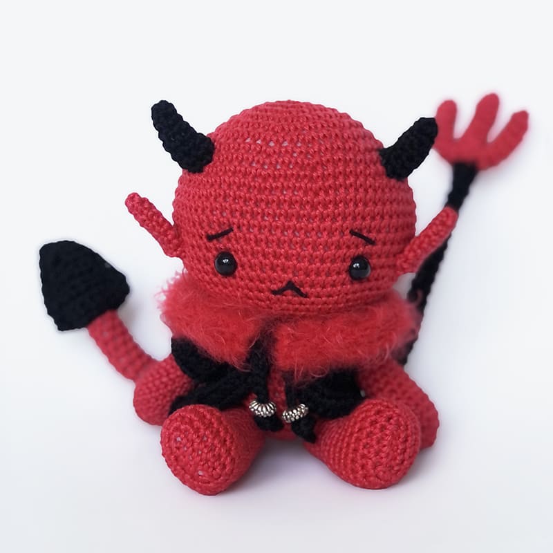 Devil stuffed toy with pitchfork