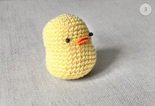 Crochet baby chicken with felt beak and eyes added.