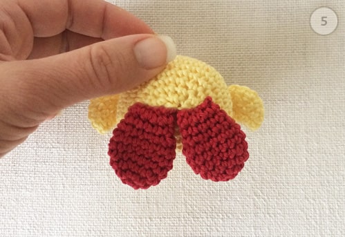 Feet crocheted and sewed onto baby chicken's body.