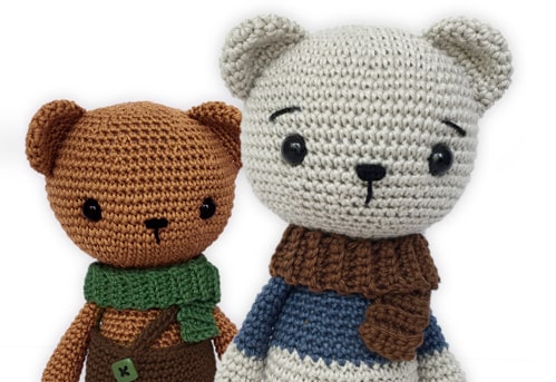 Crochet bears standing next to each other