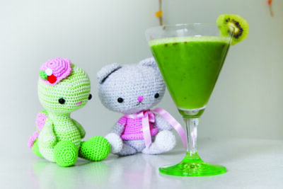 Crochet toys watching green smoothie!